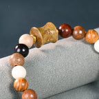 Men's & Women's Natural Wood Buddhist Mala Bead Bracelet - Smooth Spherical Zen Meditation Jewelry with Clear Beads & Intricate Wood Grain Patterns, Luck Charm, Spiritual Protection